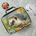 Lunch bag with hedgehog design and 'Scarlett' custom text on a table with a drink and utensils.