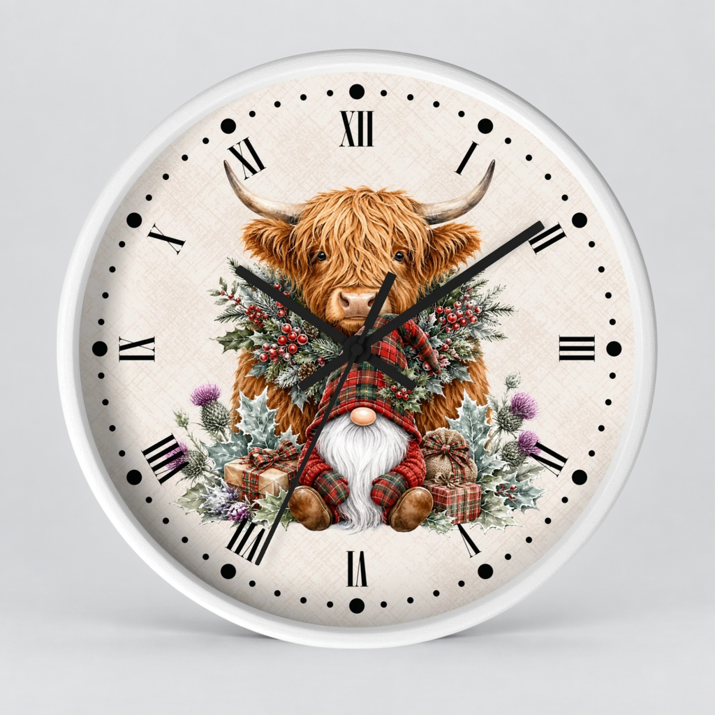 A round wall clock with a white frame and a festive illustrated face. The design shows a shaggy Highland cow surrounded by a green wreath with red berries, a small gnome in a red plaid outfit, and holiday gifts on a light beige textured background with black Roman numerals and dot hour markers.