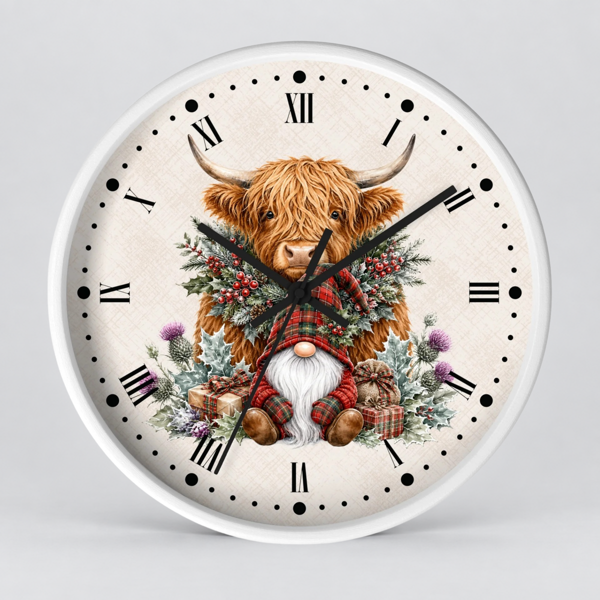 A round wall clock with a white frame and a festive illustrated face. The design shows a shaggy Highland cow surrounded by a green wreath with red berries, a small gnome in a red plaid outfit, and holiday gifts on a light beige textured background with black Roman numerals and dot hour markers.