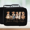 Black lunch bag with illustrations of cows and text 'Just a Thrifty Heifer' on a light background