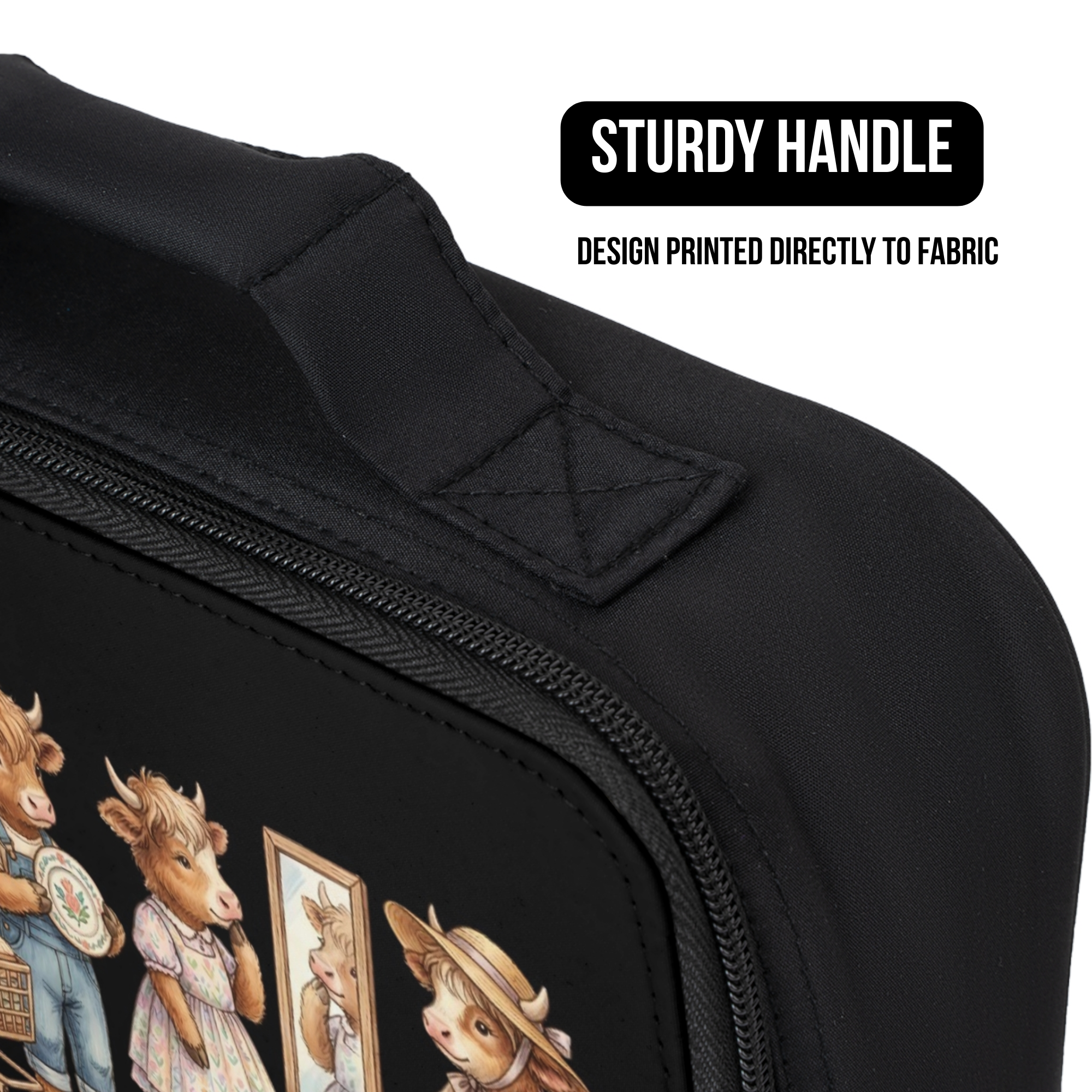 Black lunch bag with cow design printed directly to the fabric and sturdy handle feature