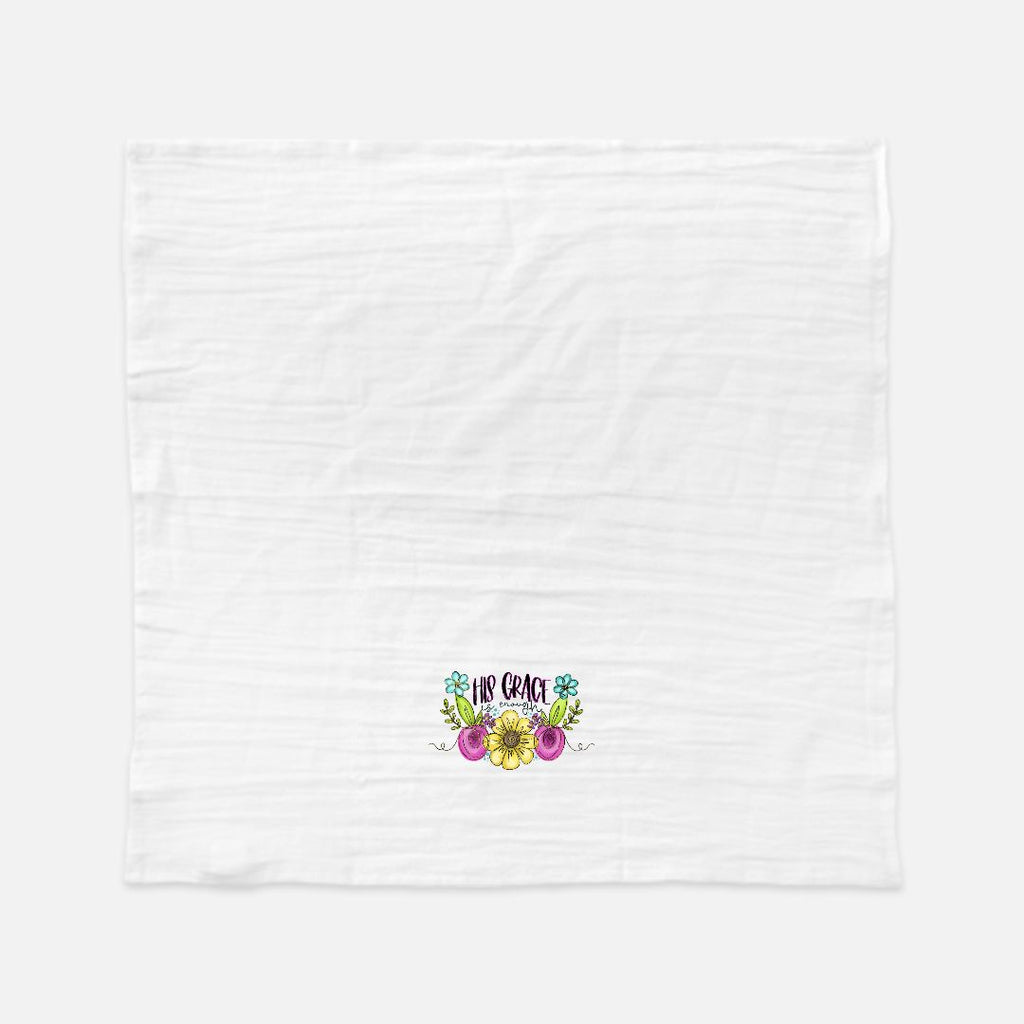 White tea towel with colorful floral design and text on a white background