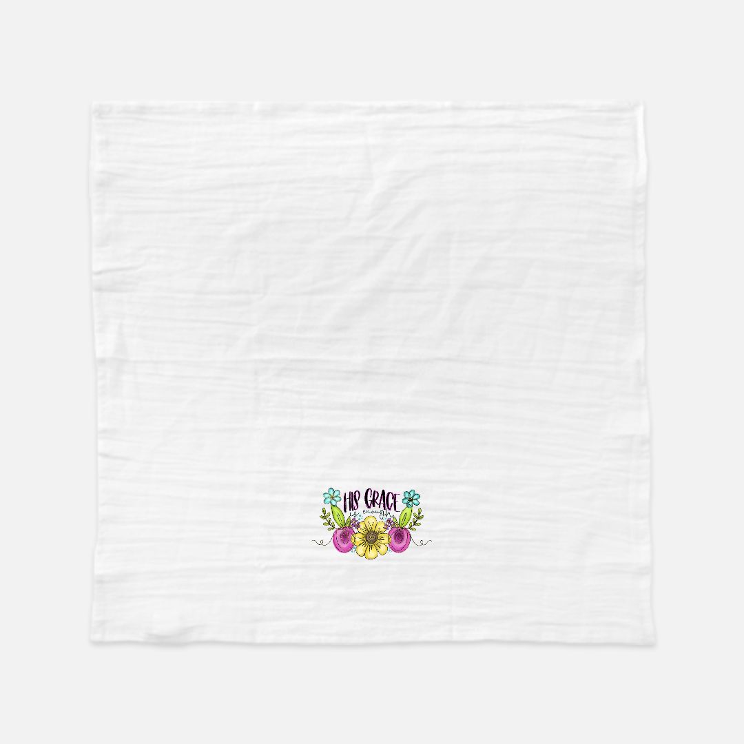 White tea towel with colorful floral design and text on a white background