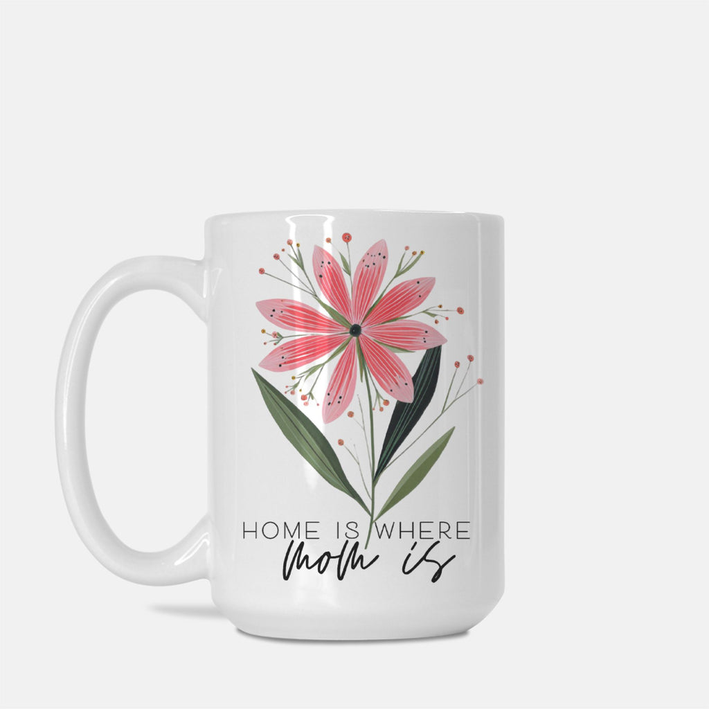 White mug with pink floral design and 'Home is where mom is' text on a white background