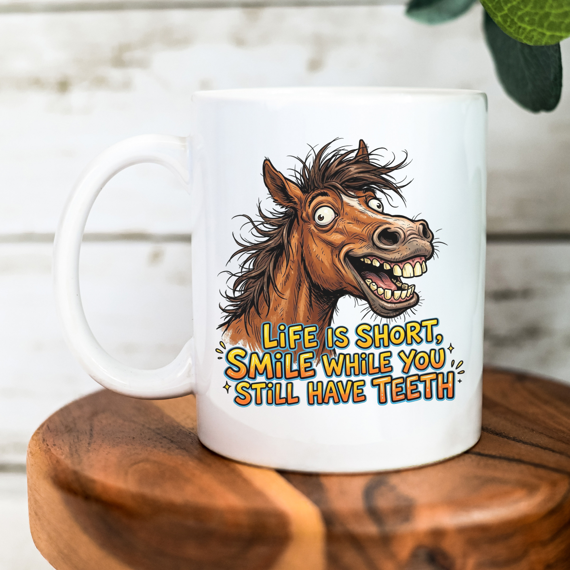White mug with a horse illustration and humorous text on a wooden surface.