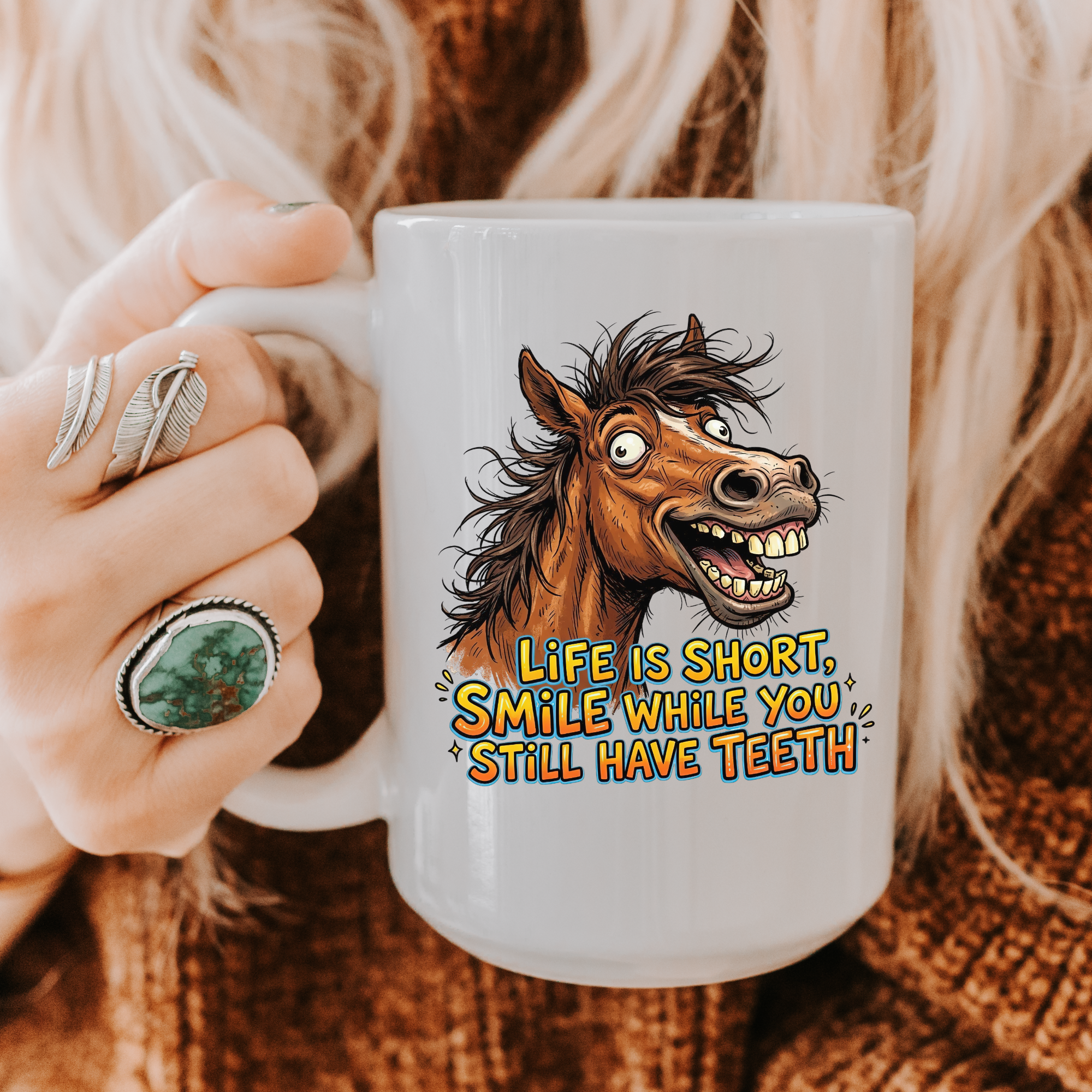 15oz. Mug with a horse graphic and text 'Life is short, smile while you still have teeth' held by a person.