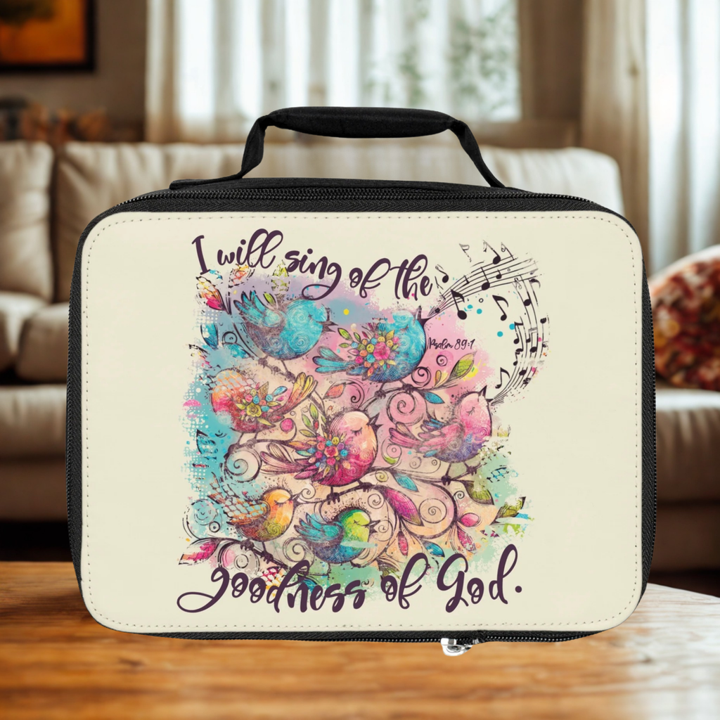  insulated lunch bag with colorful bird design and text on a wooden coffee table 