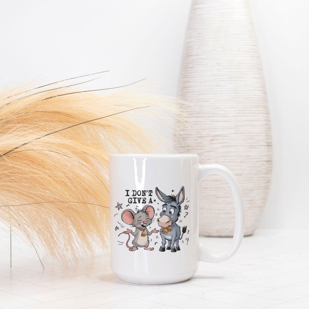 White mug with cartoon mouse and donkey design and text on a white background