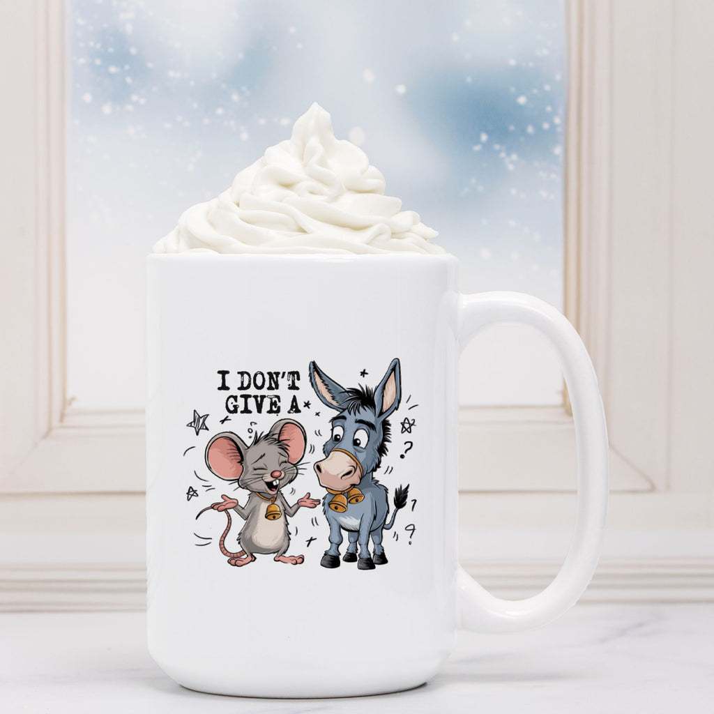 White mug with cartoon mouse and donkey design and text 'I Don't Give A', against a snowy background.