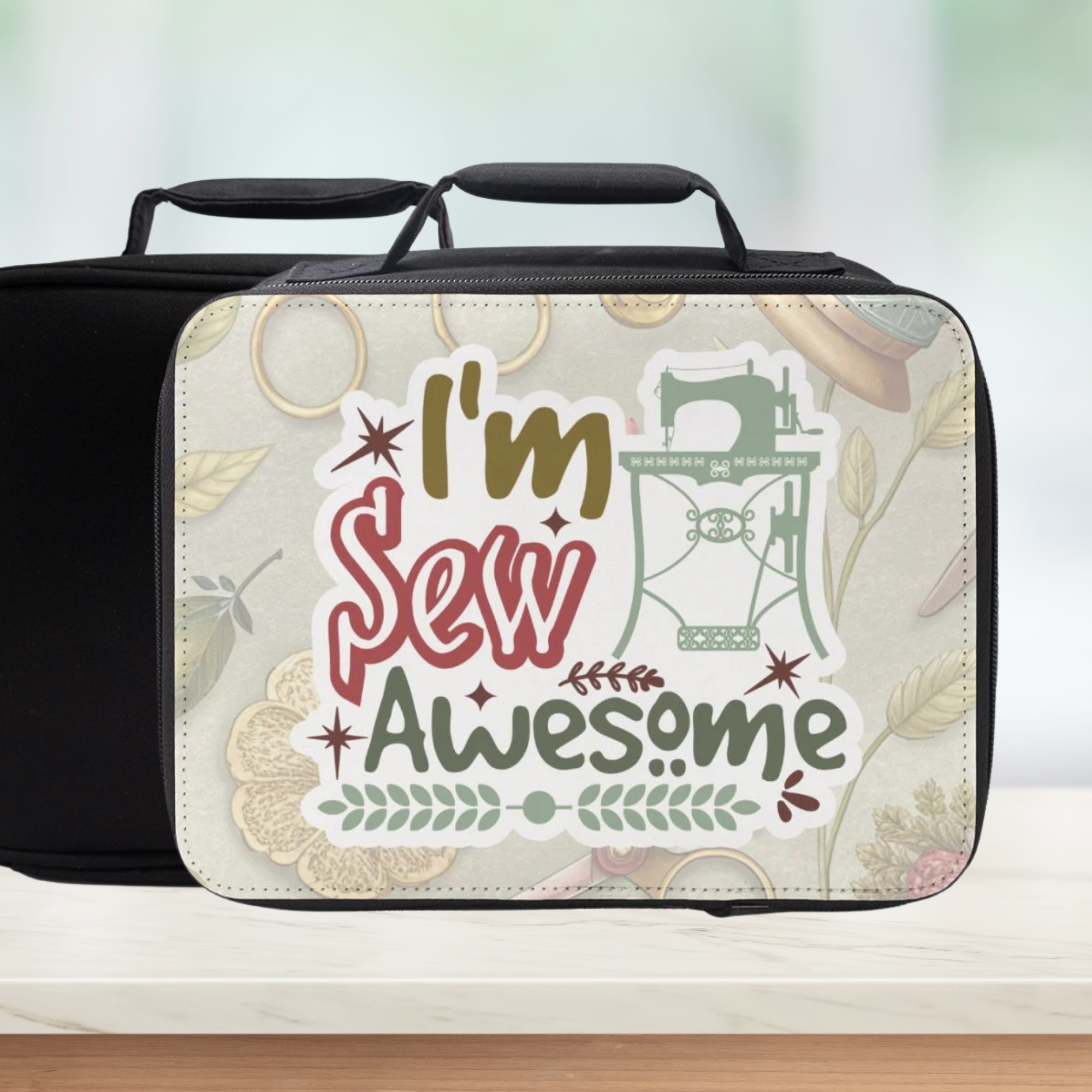 Black insulated lunch bag with 'I'm Sew Awesome' design on a light background