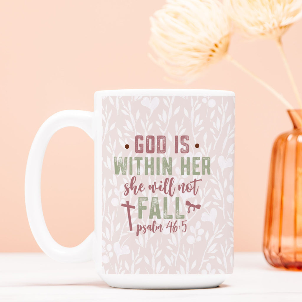 White mug with motivational quote on a light pink background