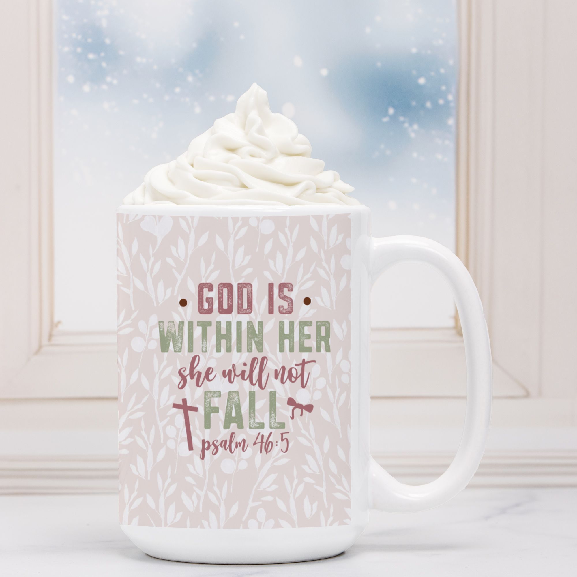 White mug with text 'God is within her, she will not fall' against a snowy window background