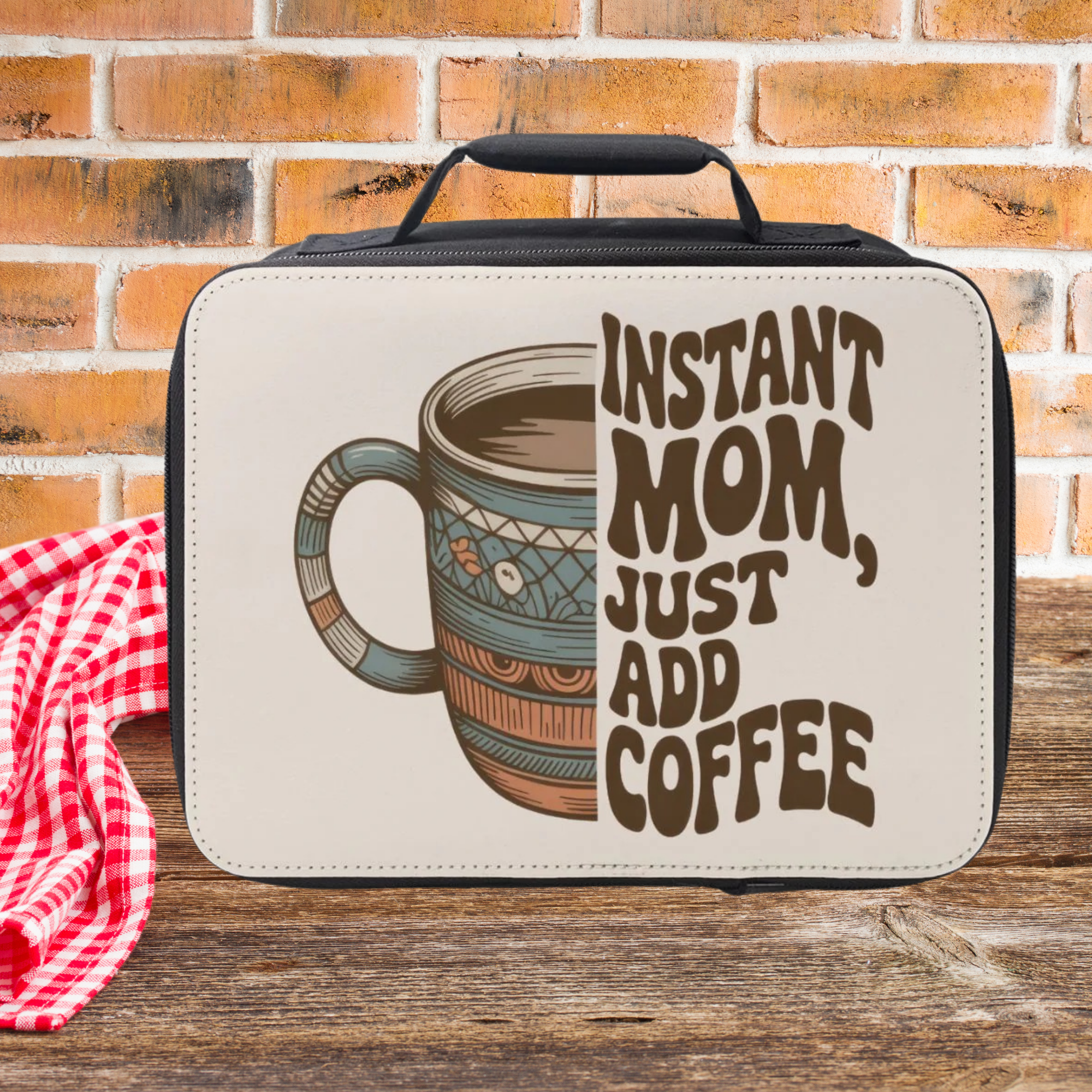  insulated lunch bag with coffee graphic and text 'Instant Mom, Just Add Coffee' on a brick wall background