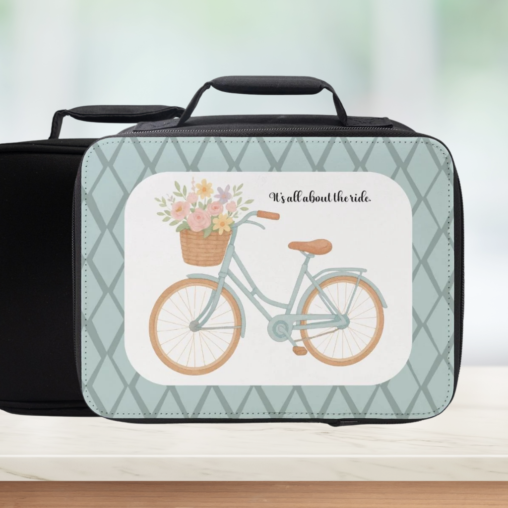 Black lunch bag with bicycle and floral design on a light green background