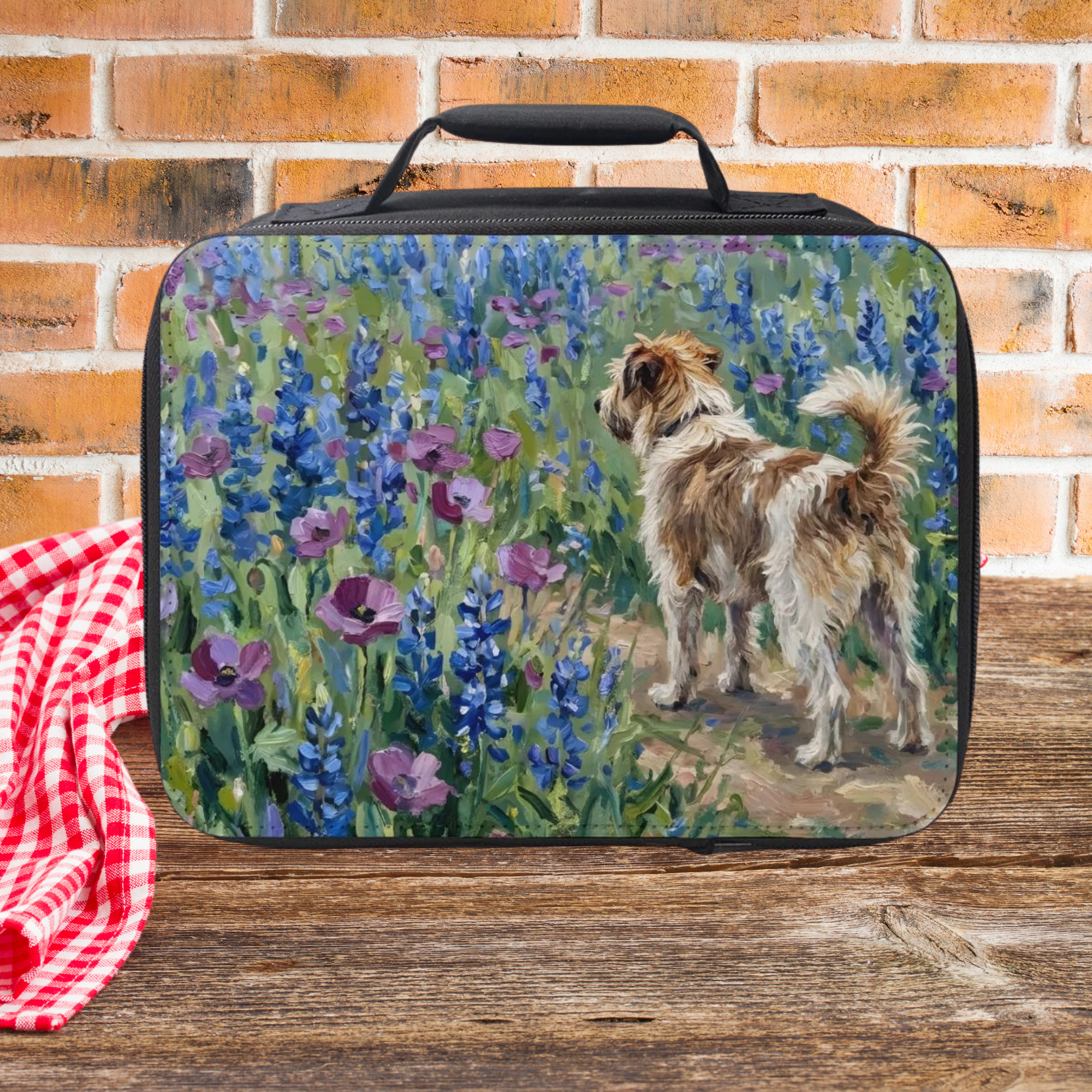 Lunch bag with a jack Russell terrier dog and floral design on a wooden picnic table with a brick wall background