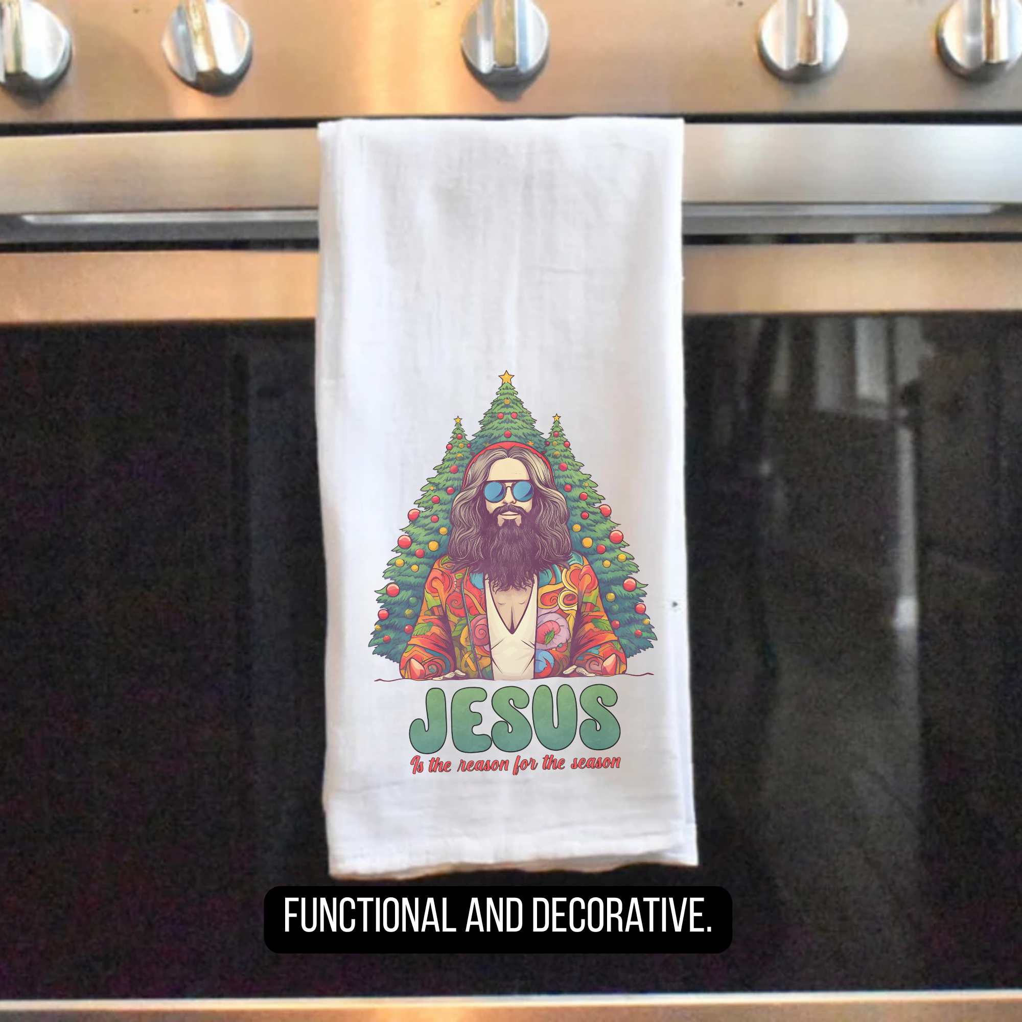 Towel with a Christmas-themed design of Jesus sitting in a tree, hanging on a stove handle.