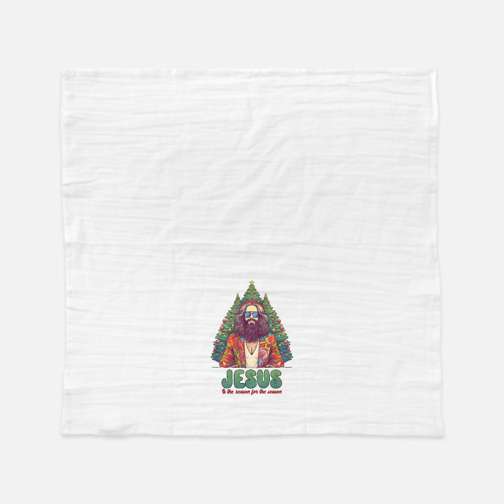 White tea towel with a graphic of a bearded figure in a Christmas tree and 'Jesus' text on a white background