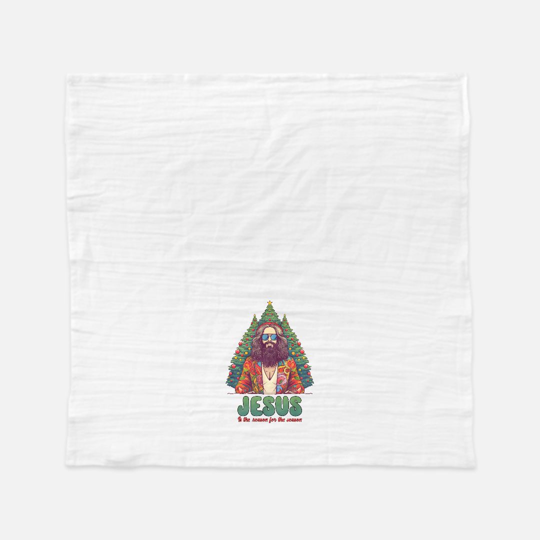 White tea towel with a graphic of a bearded figure in a Christmas tree and 'Jesus' text on a white background
