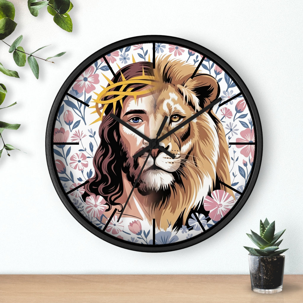 Round black wall clock with a design of a lion's head and Jesus' face, surrounded by floral patterns on a white wall.