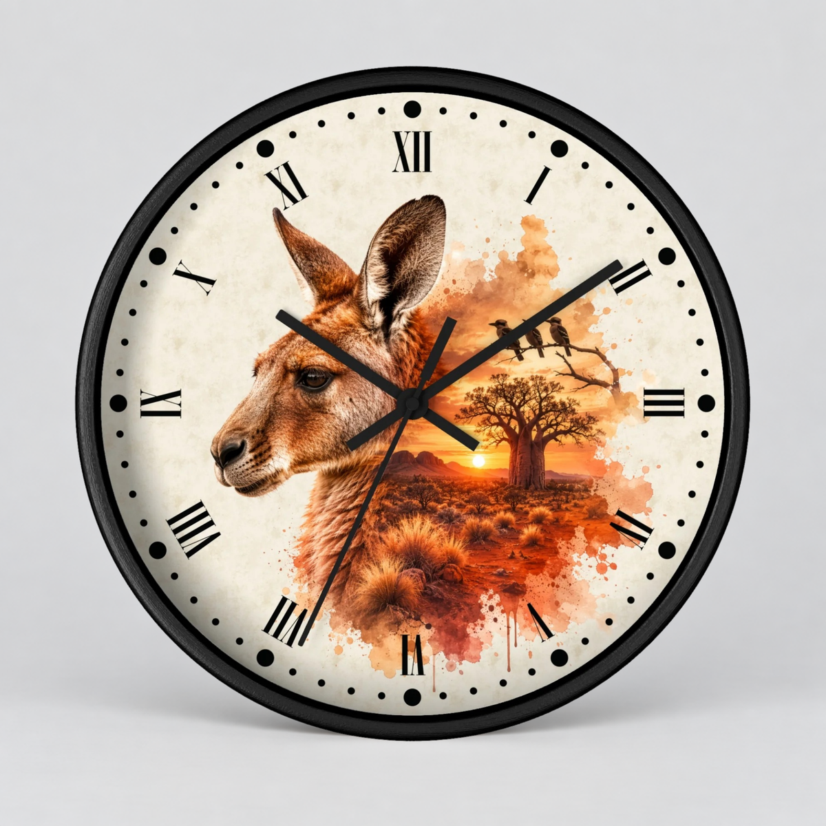 A round wall clock with a black frame and a cream-colored face featuring a kangaroo portrait, a tree, birds, and an orange sunset watercolor design. Roman numerals mark the hours, and black hands indicate time.