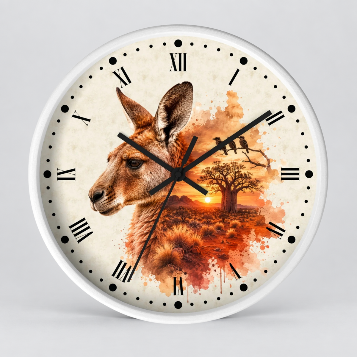 A round wall clock with a white frame and a printed dial featuring a kangaroo profile, a tree, birds, and an orange sunset scene on a light cream background.