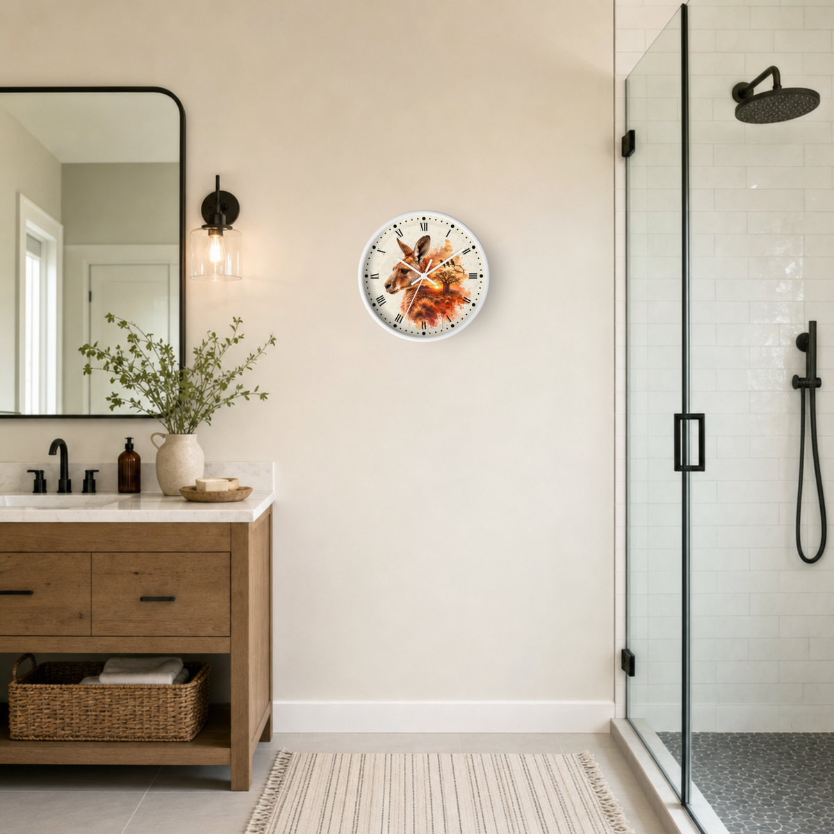 A round wall clock featuring a detailed illustration of a kangaroo, mounted on a beige wall in a modern bathroom setting with a wooden vanity, mirror, and glass shower enclosure.