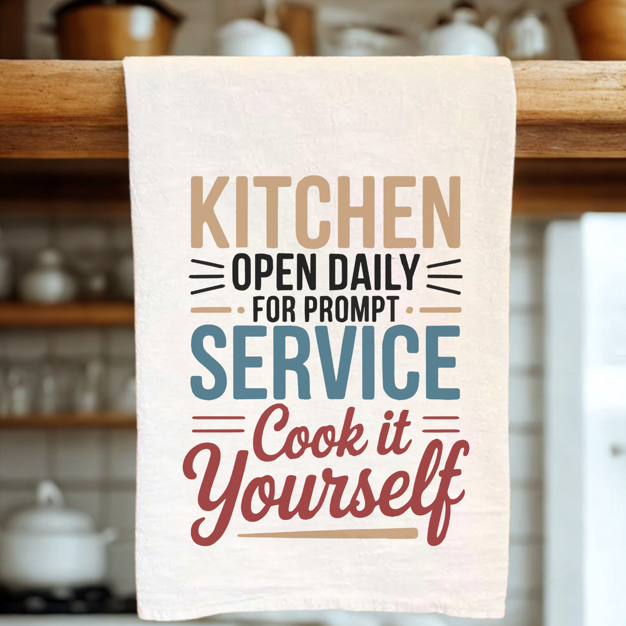 Kitchen towel with humorous text in a kitchen setting