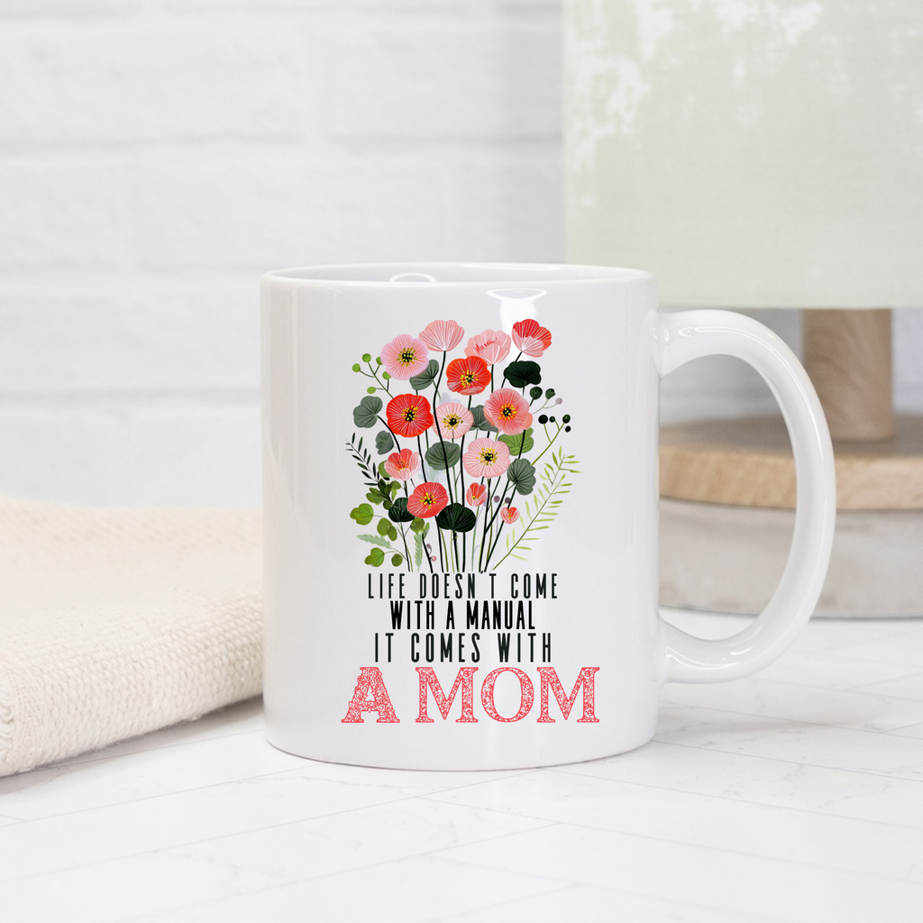 White 11oz mug with floral design and text on a light background
