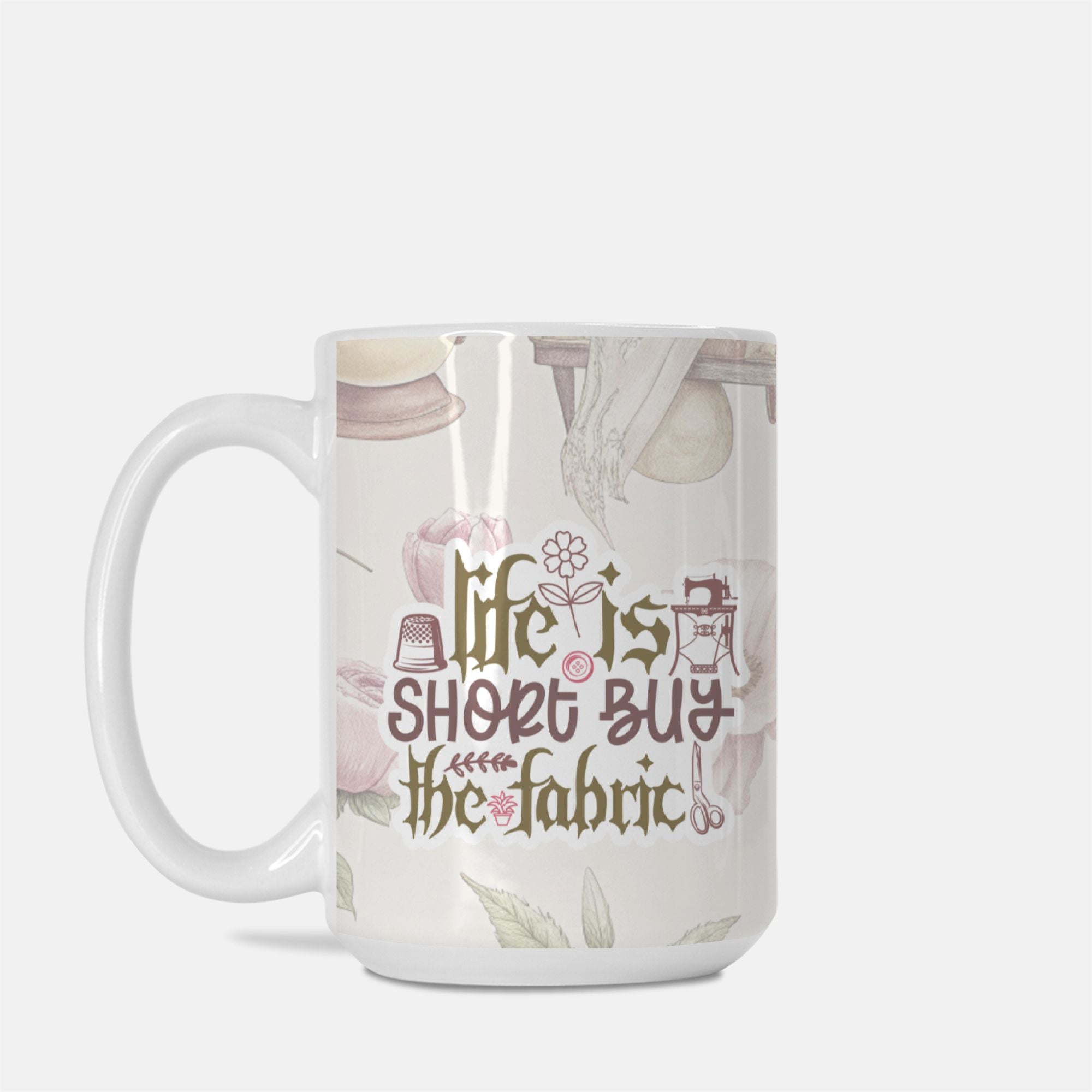 Mug with 'Life is short, buy the fabric' text and sewing-themed design on a white background