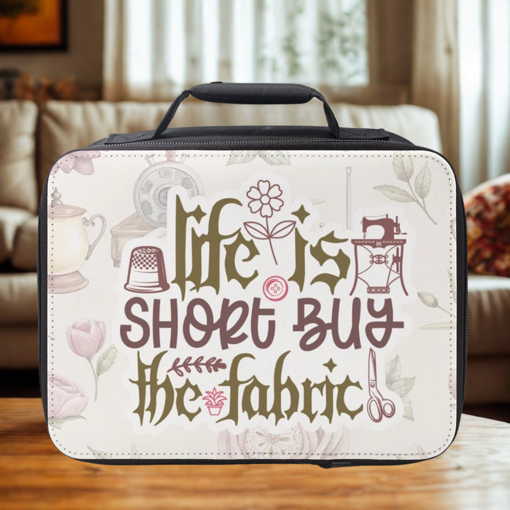Insulated lunch bag with decorative text and sewing-themed graphics on a wooden surface.