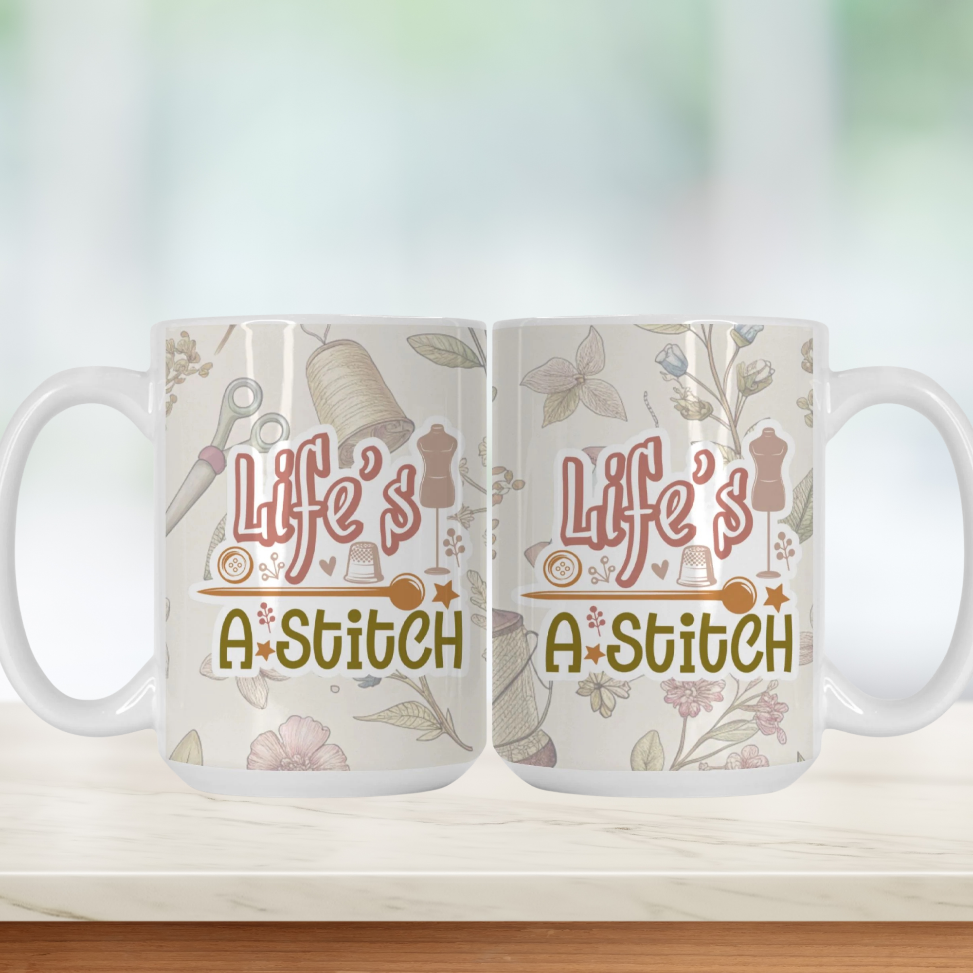 Two white mugs with 'Life's A-Stitch' design on a light background