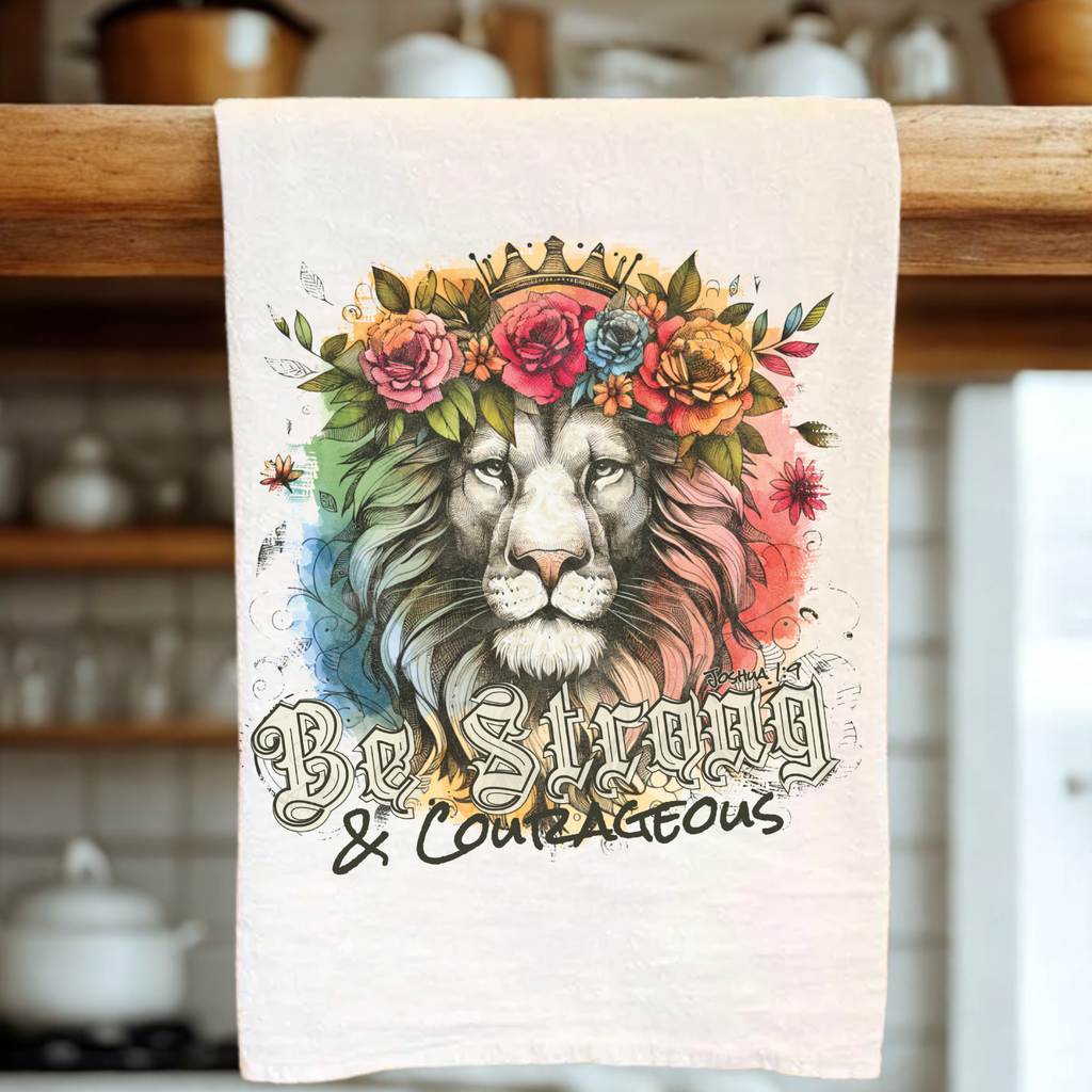 Tea towel with a lion design and 'Be Strong & Courageous' text in a kitchen setting
