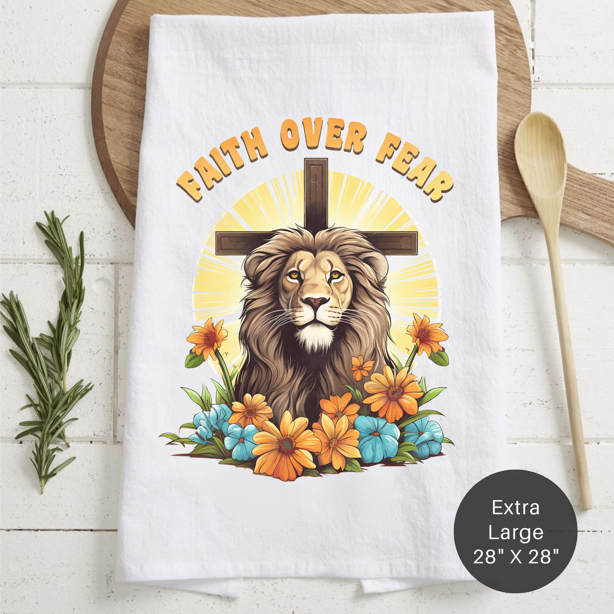 Decorative tea towel with a lion, cross, and flowers design on a wooden surface.
