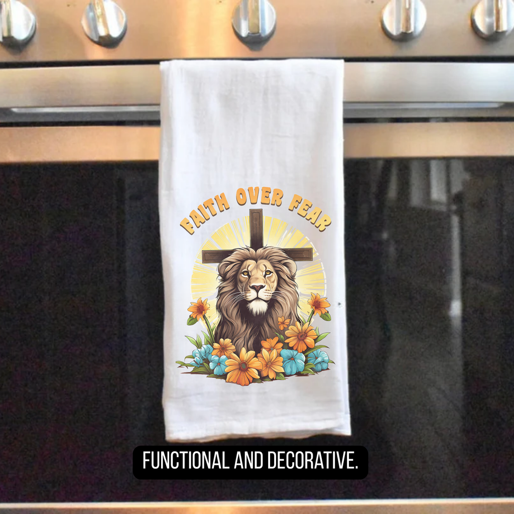 Tea towel with a lion, cross, and flowers design on an oven door.