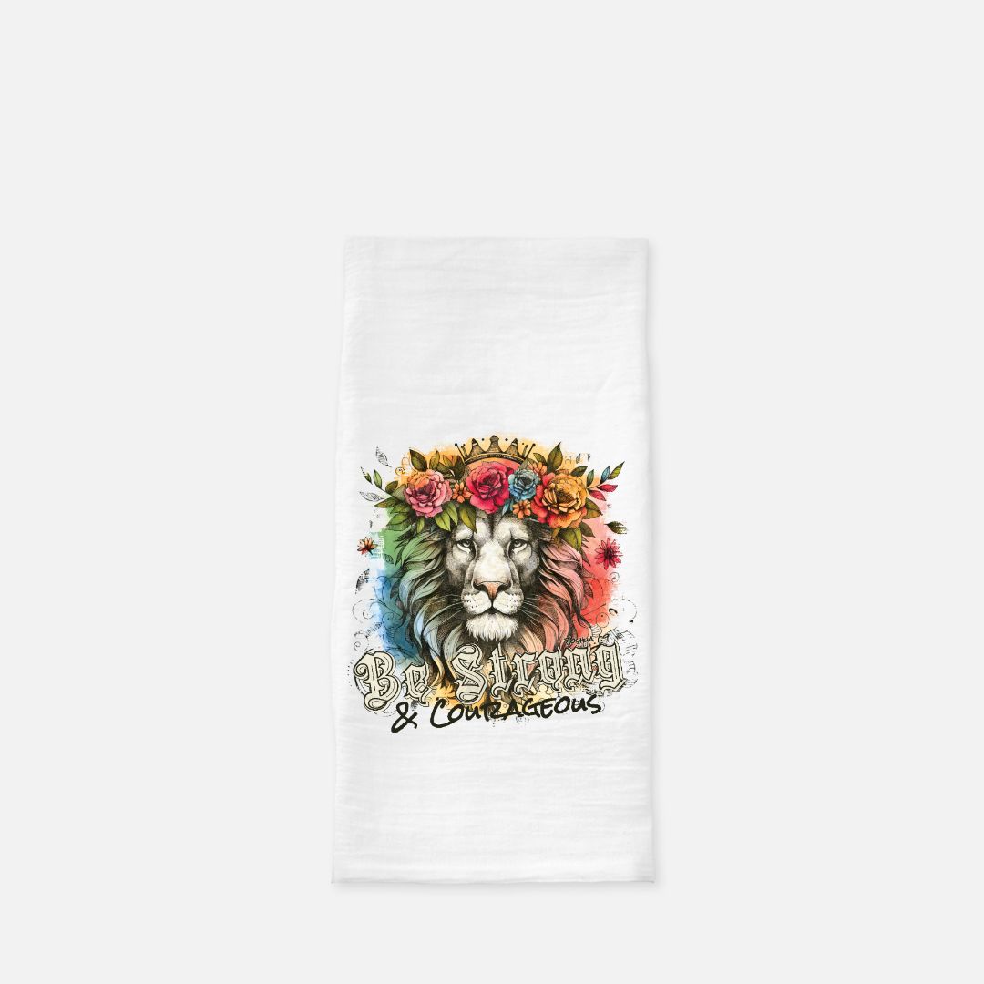 White tea towel with a colorful lion design and text on a white background