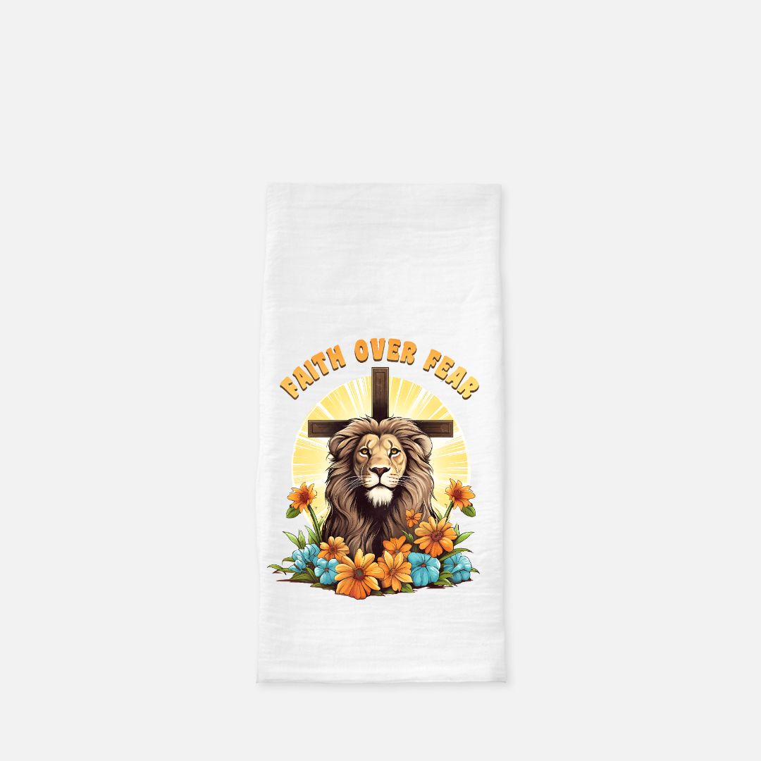 Lion with cross and flowers on a white tea towel with 'Faith Over Fear' text.