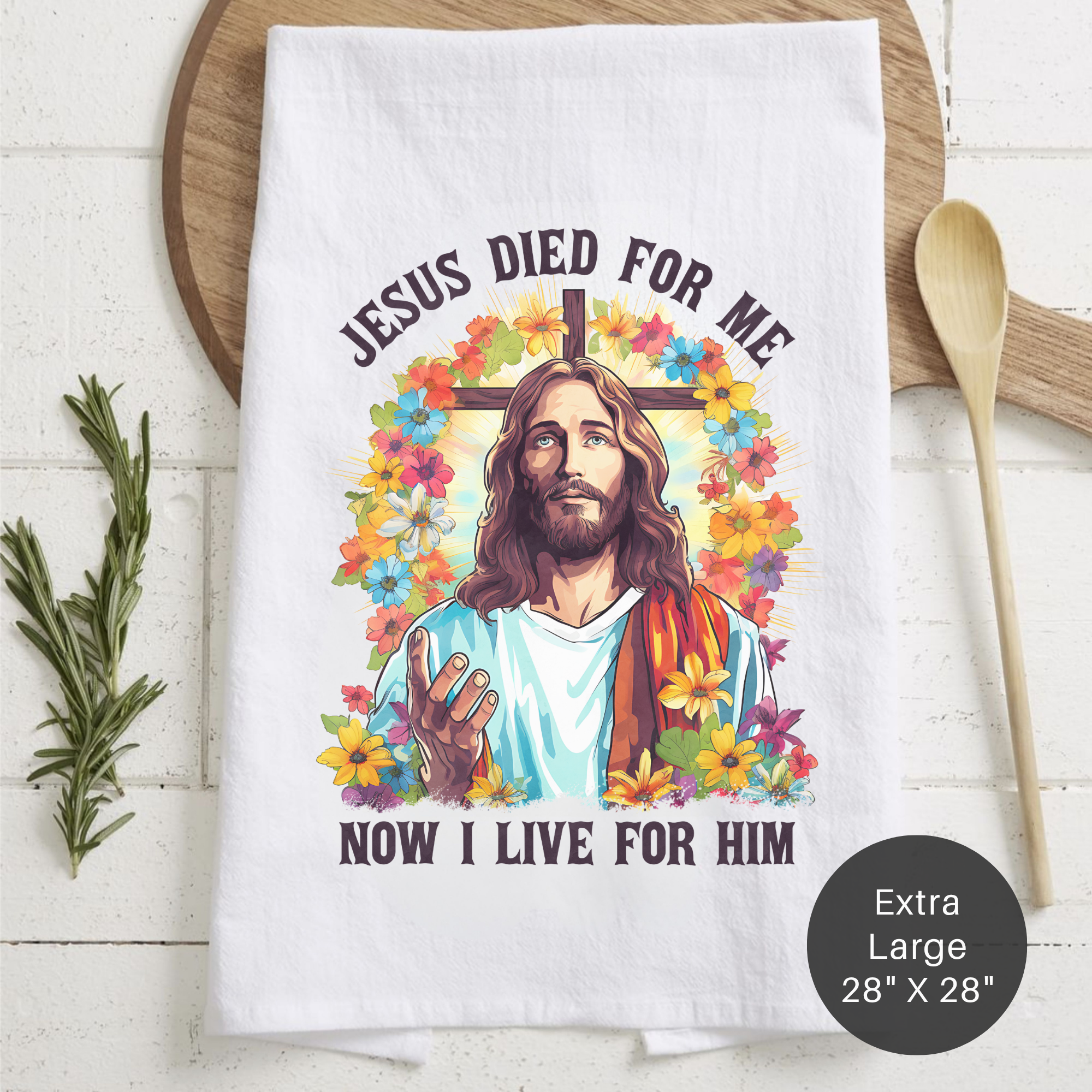 Tea towel with Jesus design and text on a wooden surface