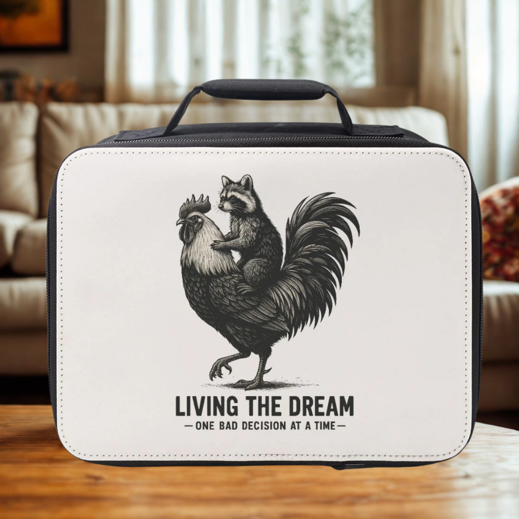 White lunch bag with rooster and raccoon illustration and 'Living the Dream' text on a wooden coffee table.