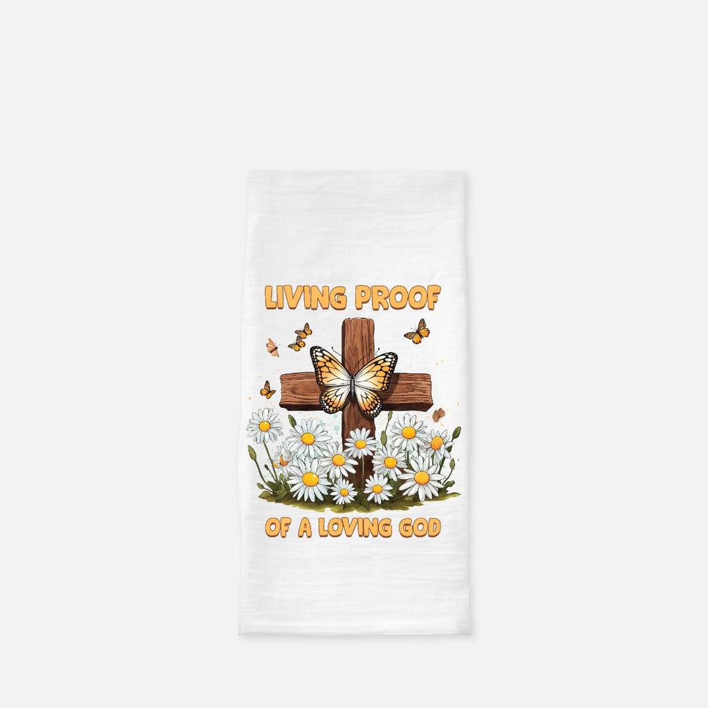 Tea towel with a cross, butterflies, and flowers design on a white background