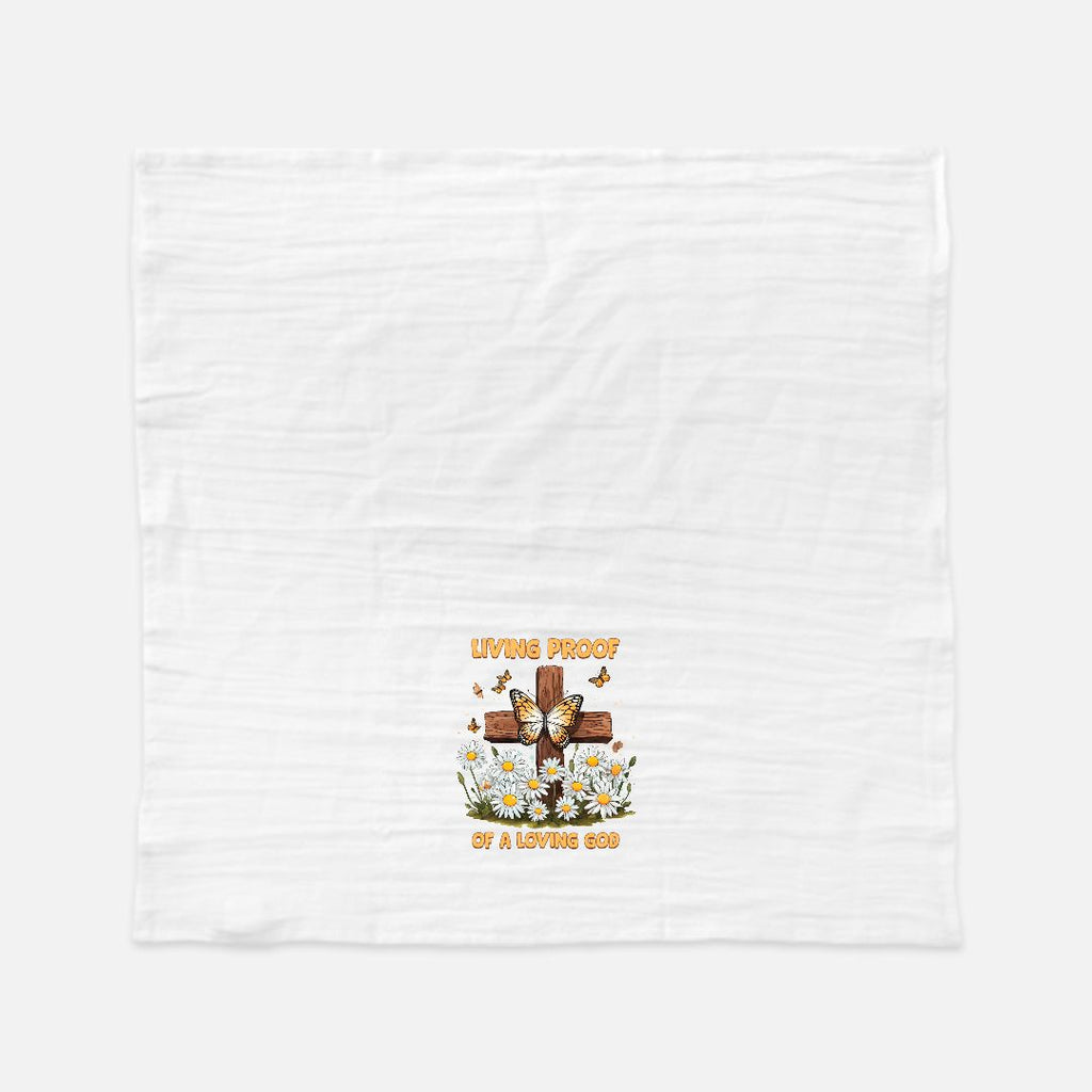 White tea towel with a graphic design of a cross, flowers, and text on a white background