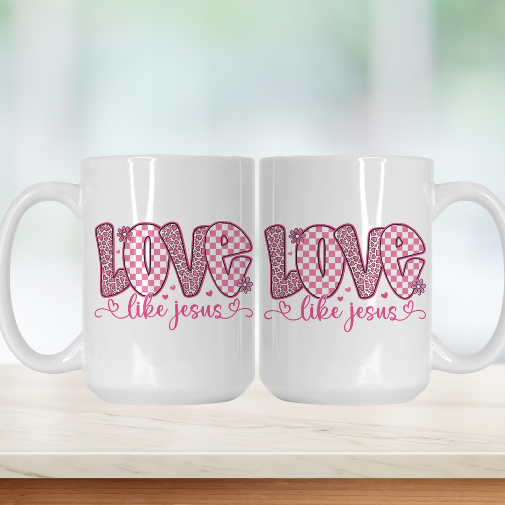 Two white mugs with pink and red text on a light background