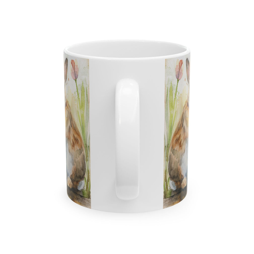 Back side of an 11oz white mug with rabbit and tulip design on a white background