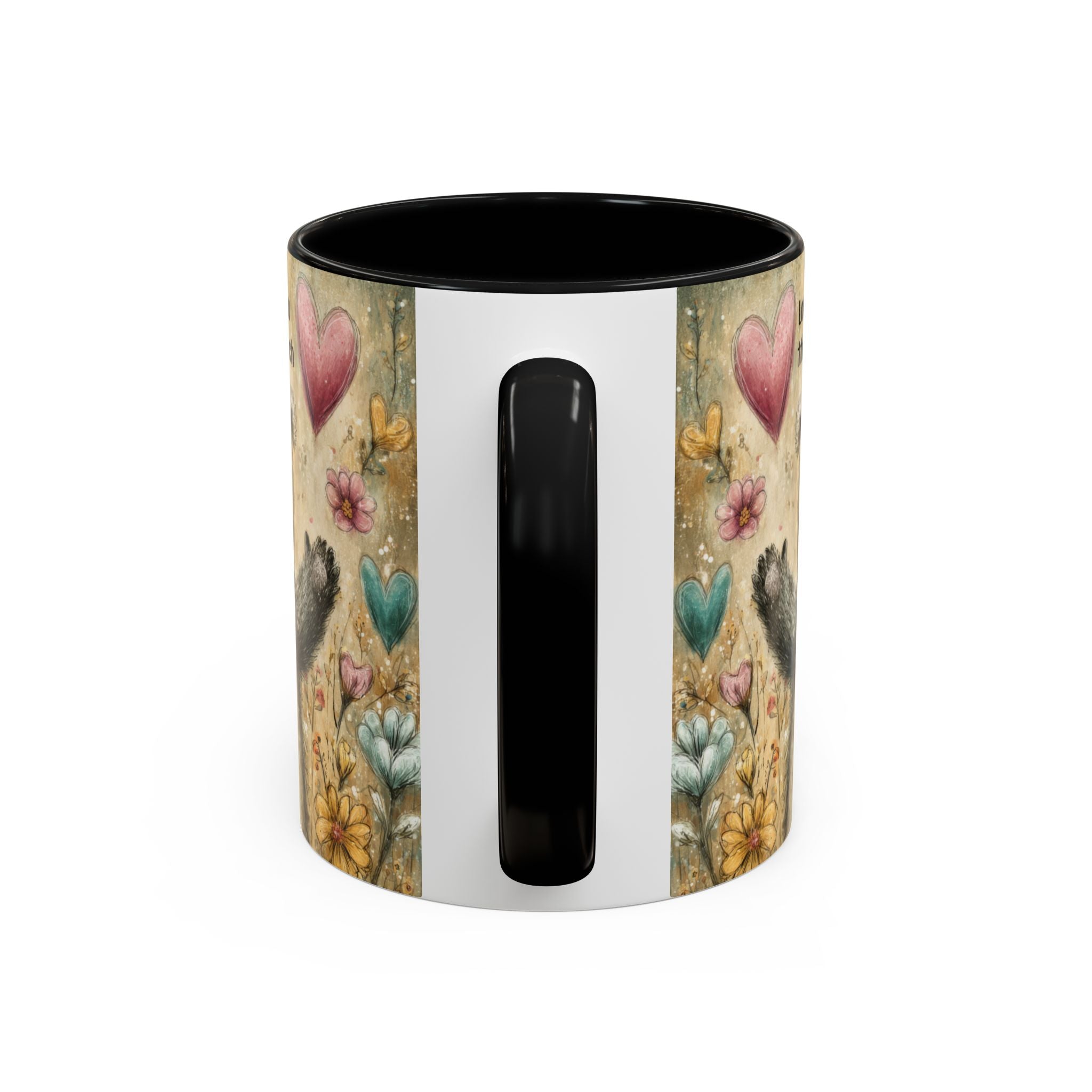 Back side of an 11oz. black accent mug with floral and heart design on a white background