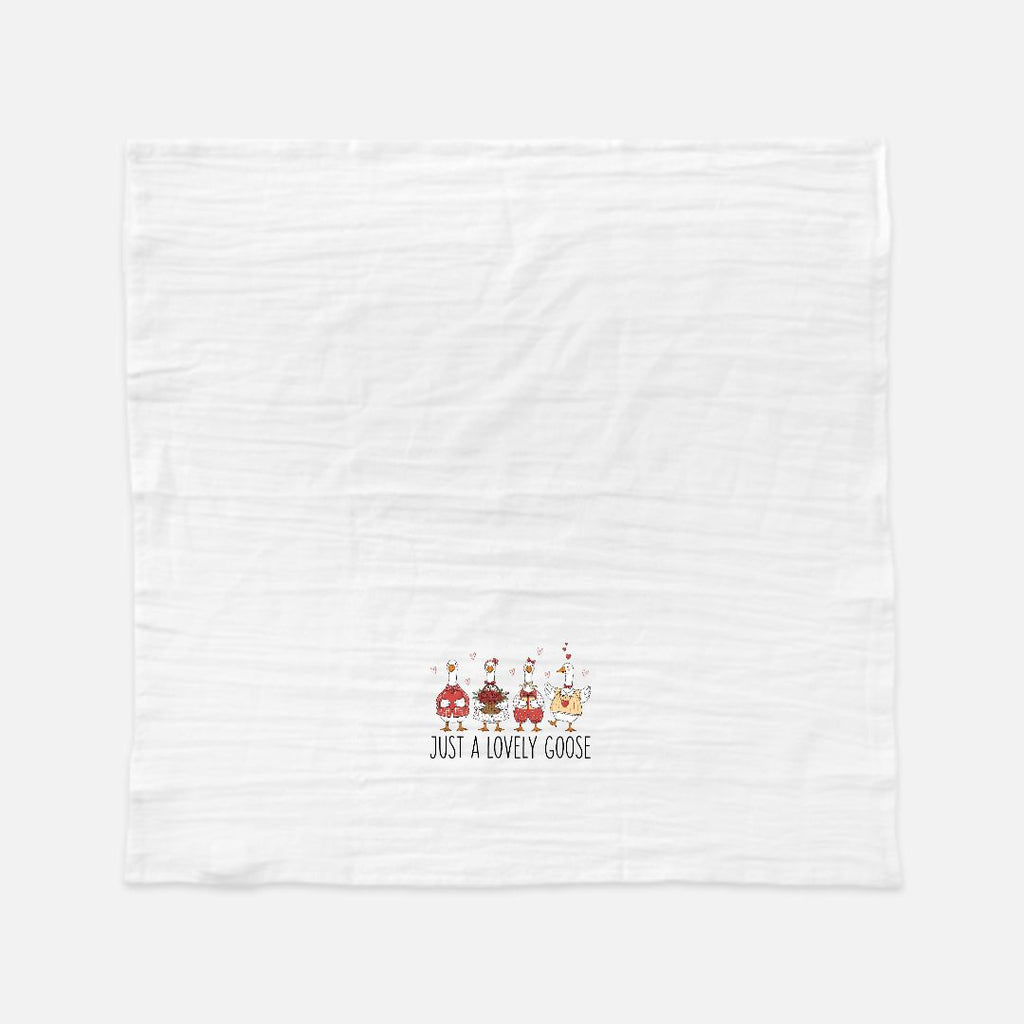 White towel with cartoon geese design and text on a white background