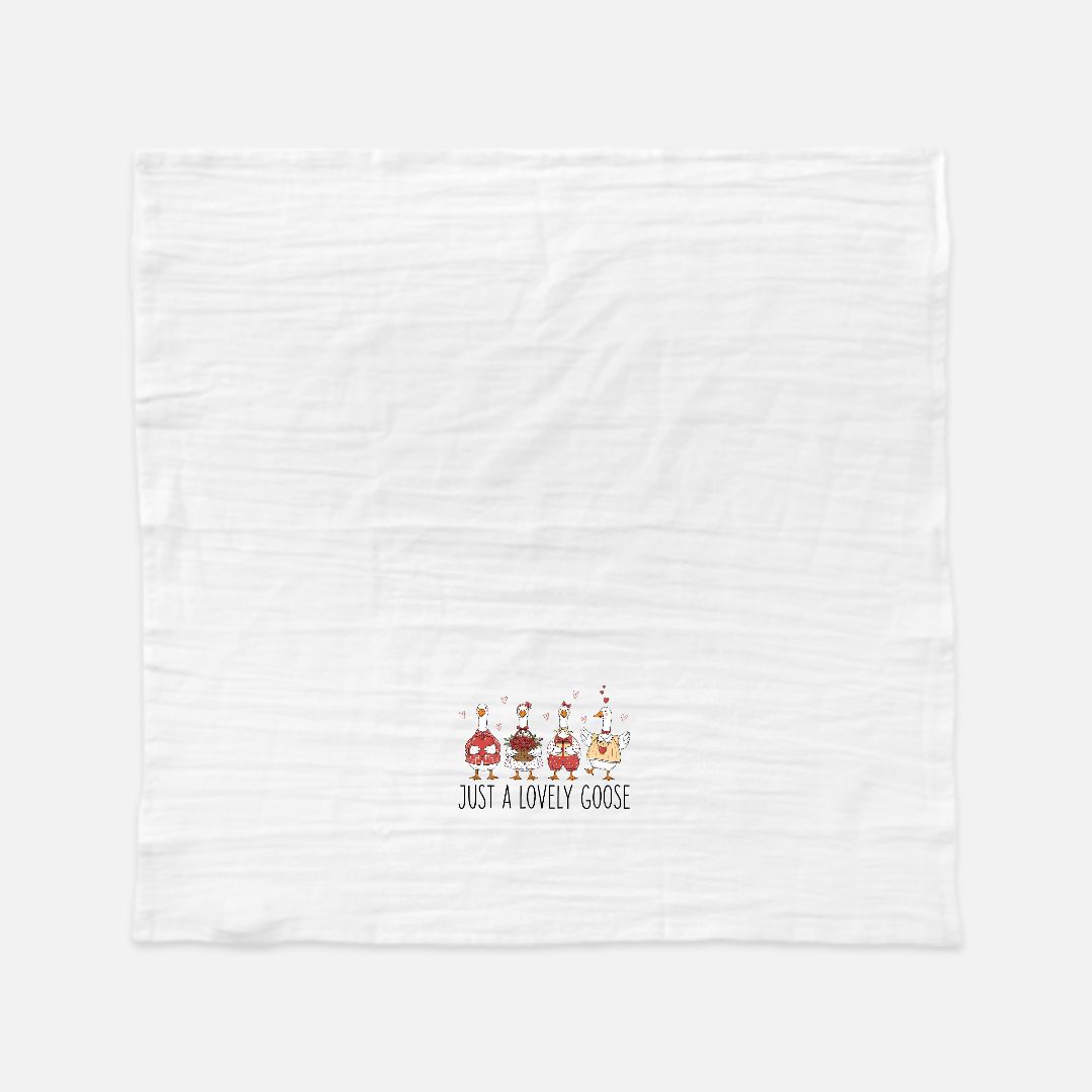 White towel with cartoon geese design and text on a white background