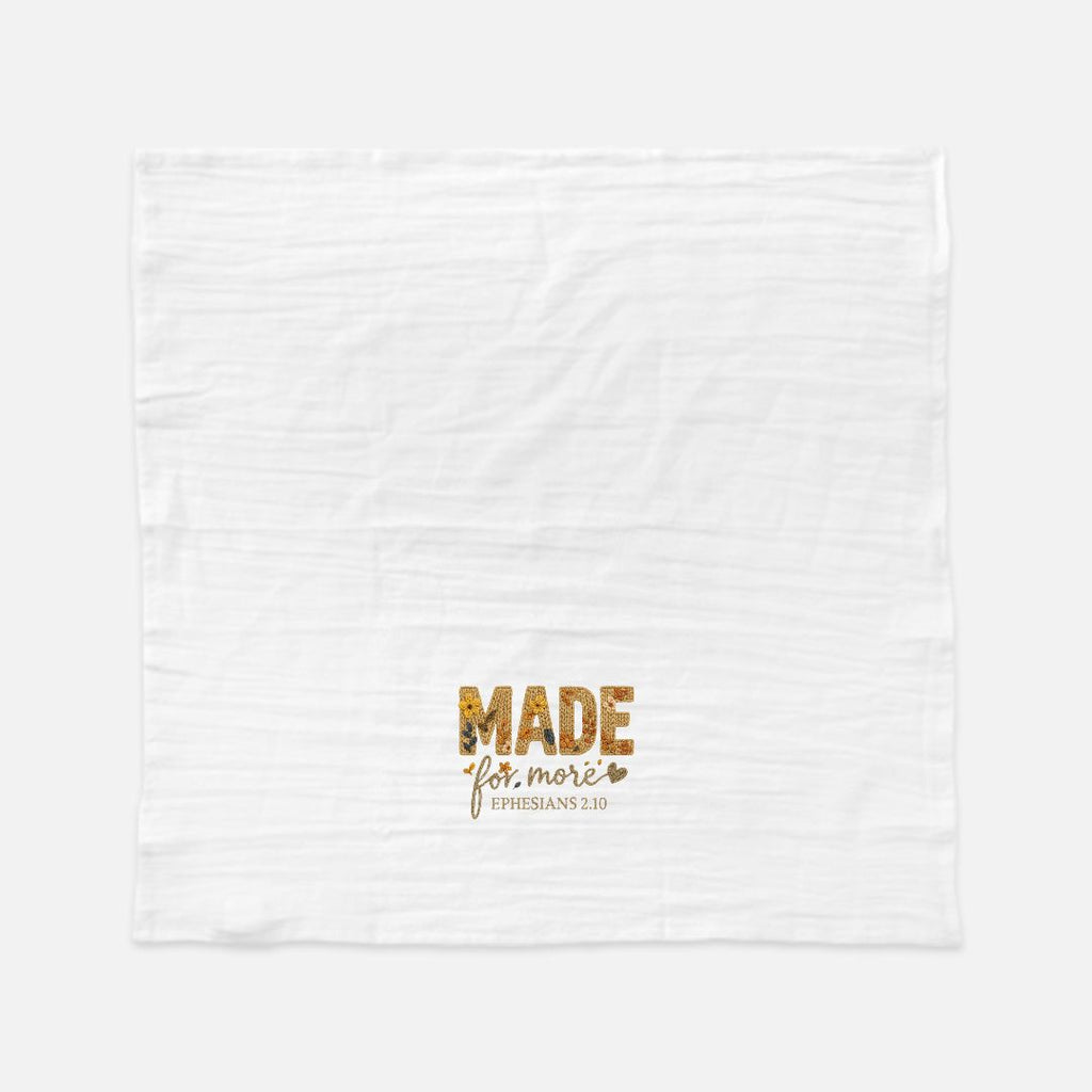 White towel with gold text 'MADE for more Ephesians 2:10' on a white background