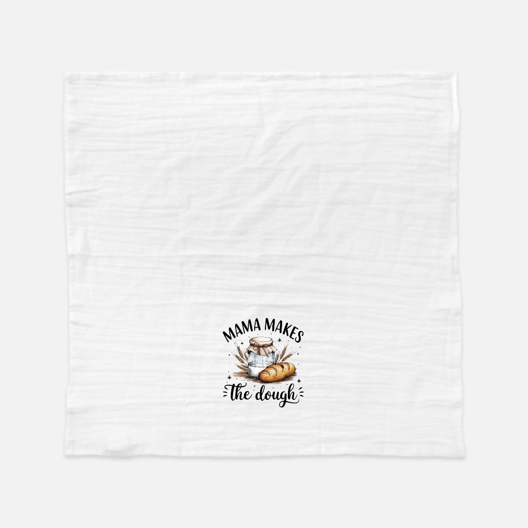 White tea towel with 'Mama Makes the Dough' text and bread graphic on a white background