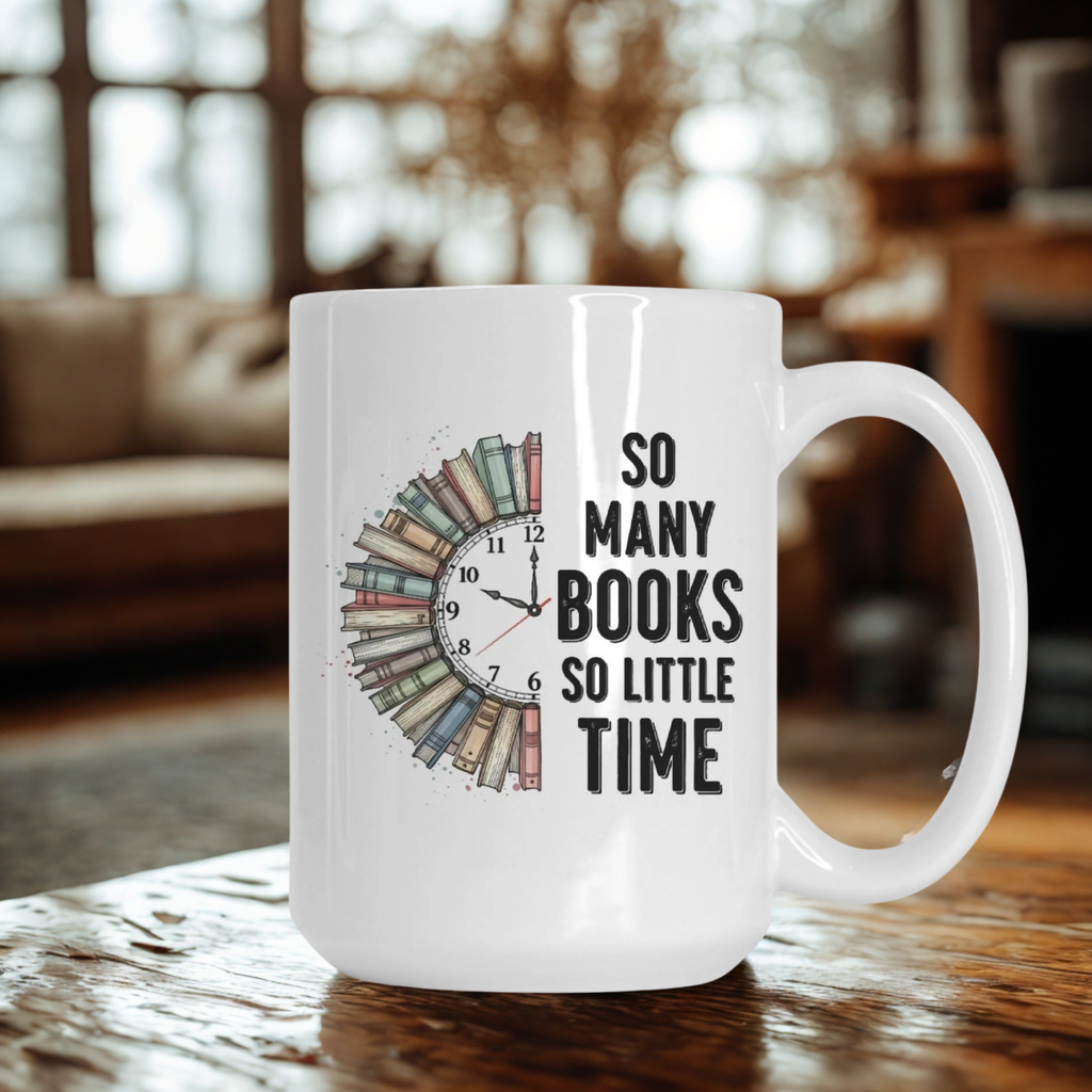 White mug with book-themed design and text 'So Many Books So Little Time' on a wooden surface.