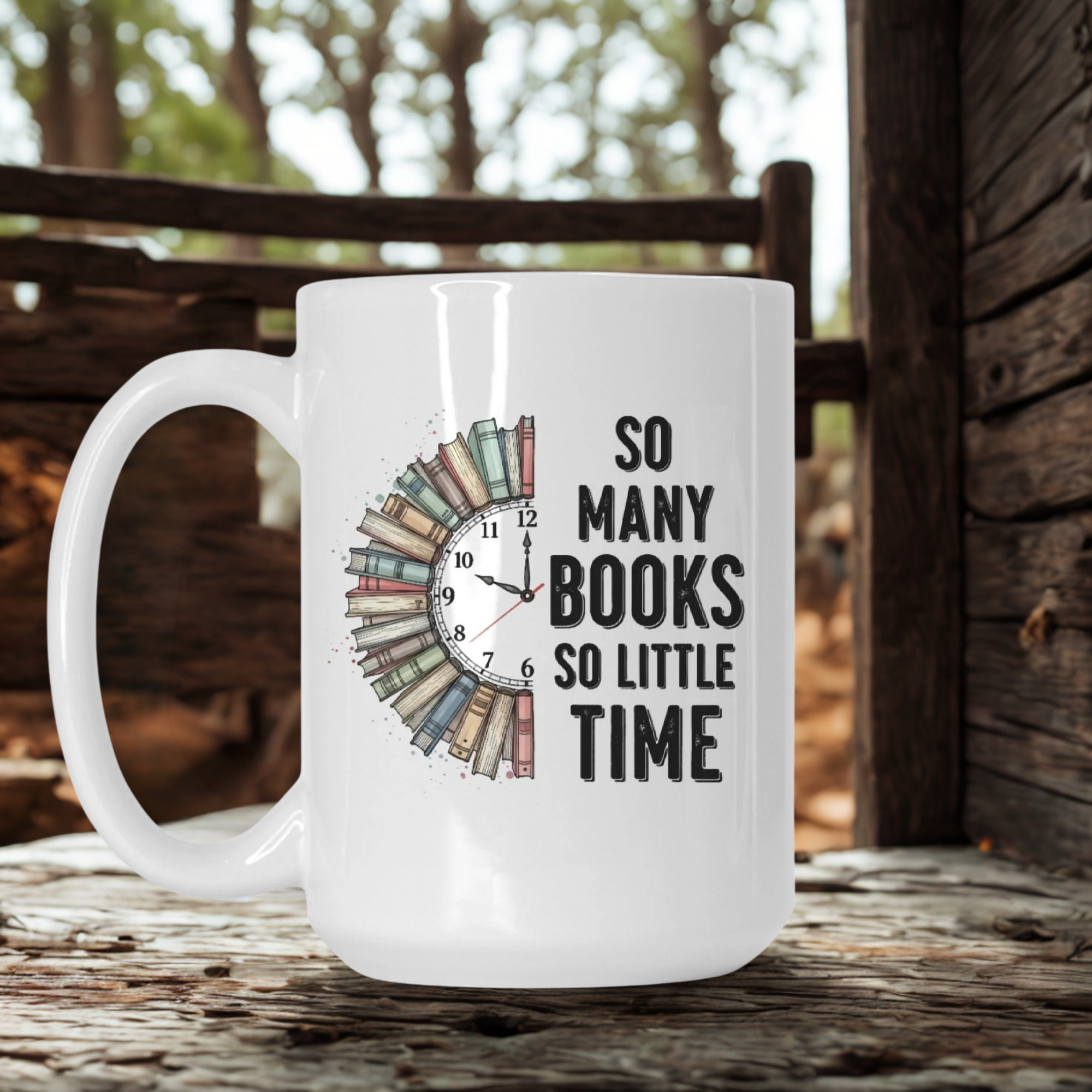 White mug with book-themed design and text 'So Many Books So Little Time' on a wooden surface.