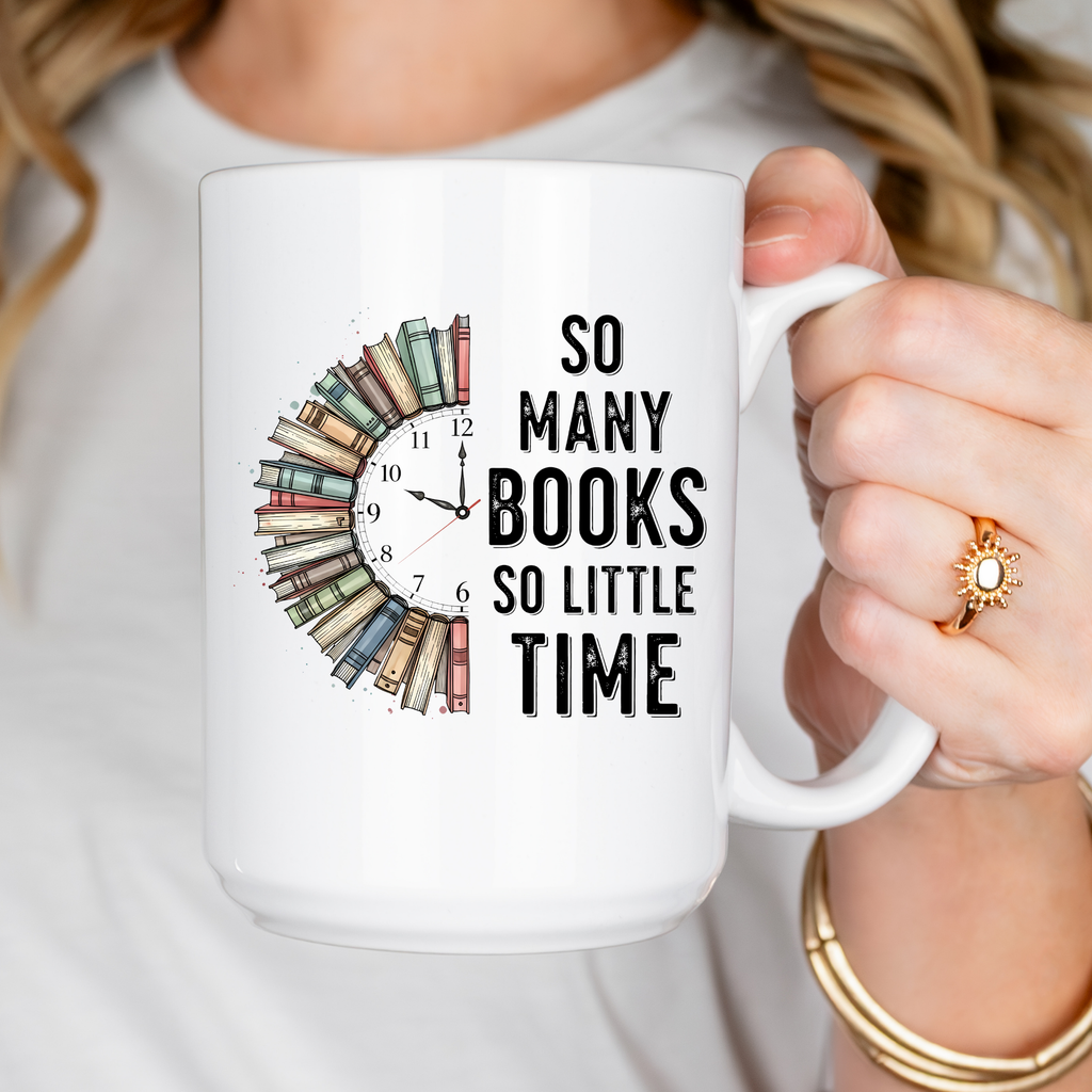 Person holding a mug with a book-themed design and text 'So Many Books So Little Time'.